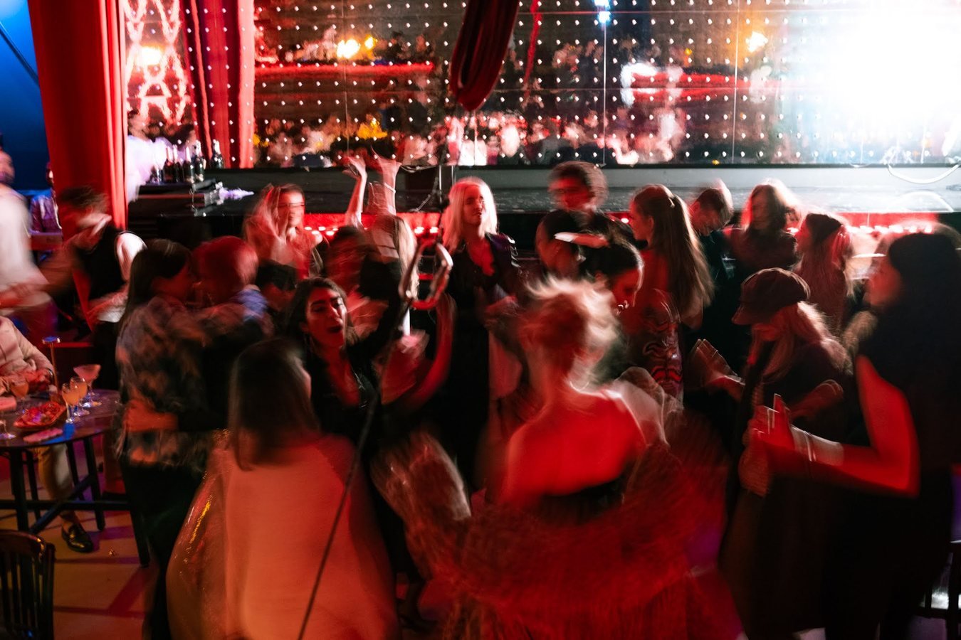 A packed dance floor in front of the Stable 54 stage.